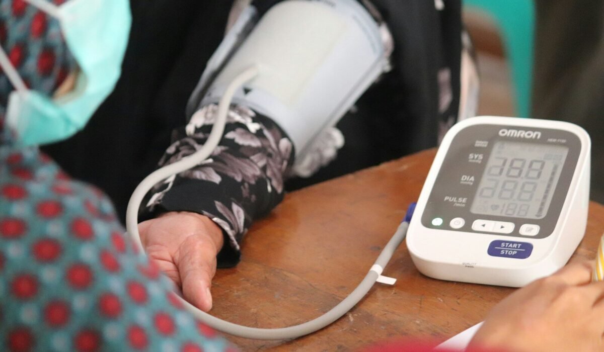 person wearing black and white long sleeve shirt