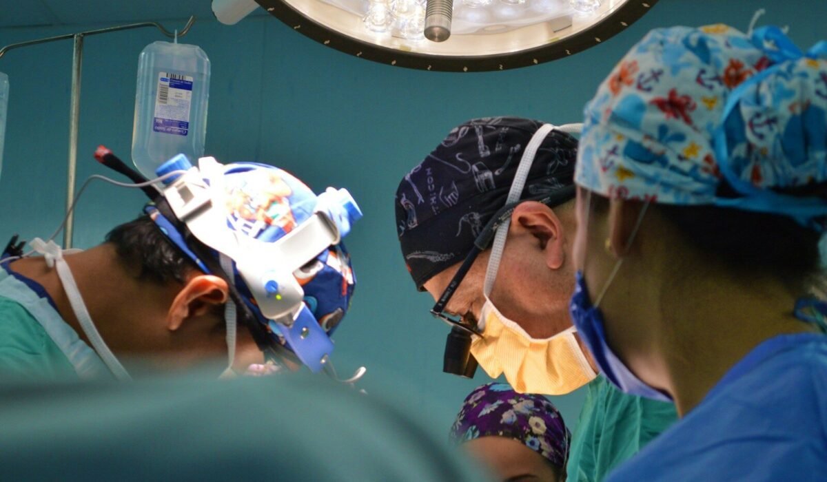 doctors wearing assorted-color scrub shirts