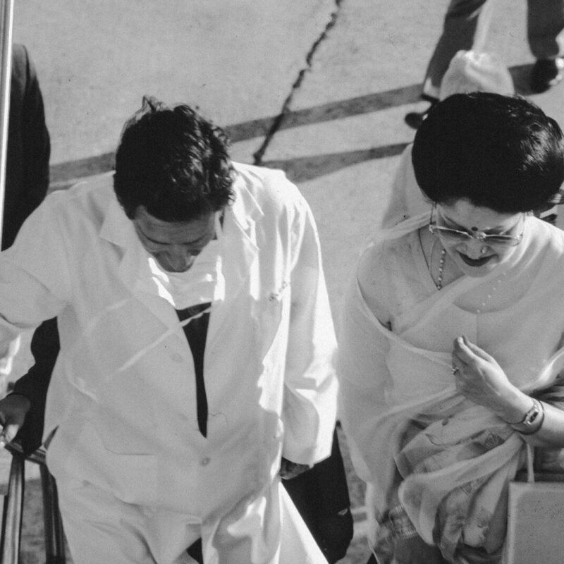 Couple descending stairs holding hands